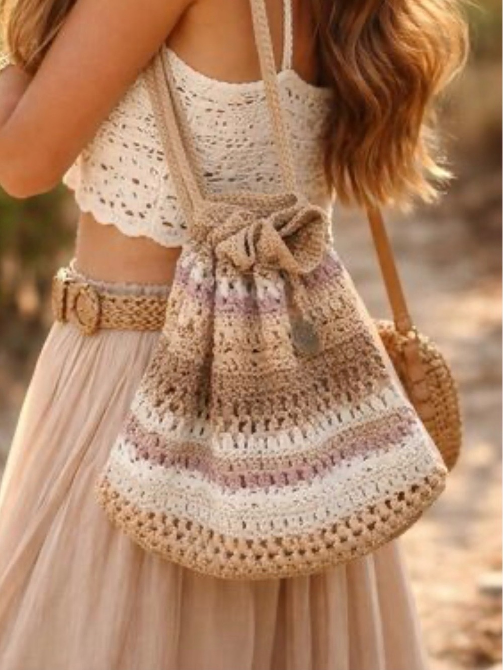 The Sak Crochet Drawstring Shoulder Bag in Beige and Cream